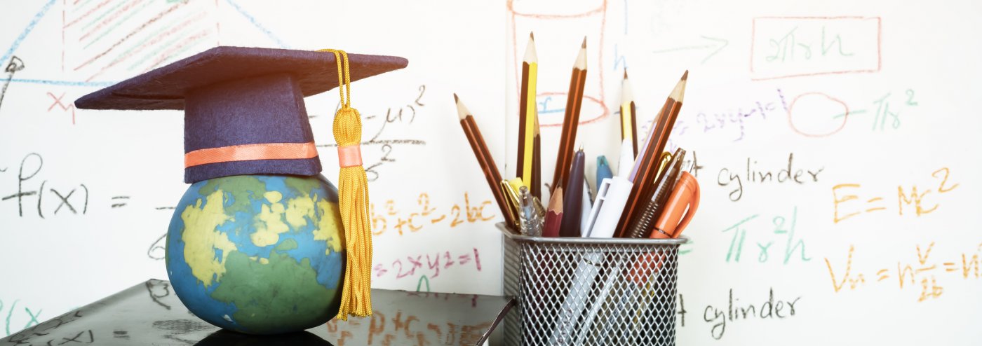 Graduation cap on earth globe